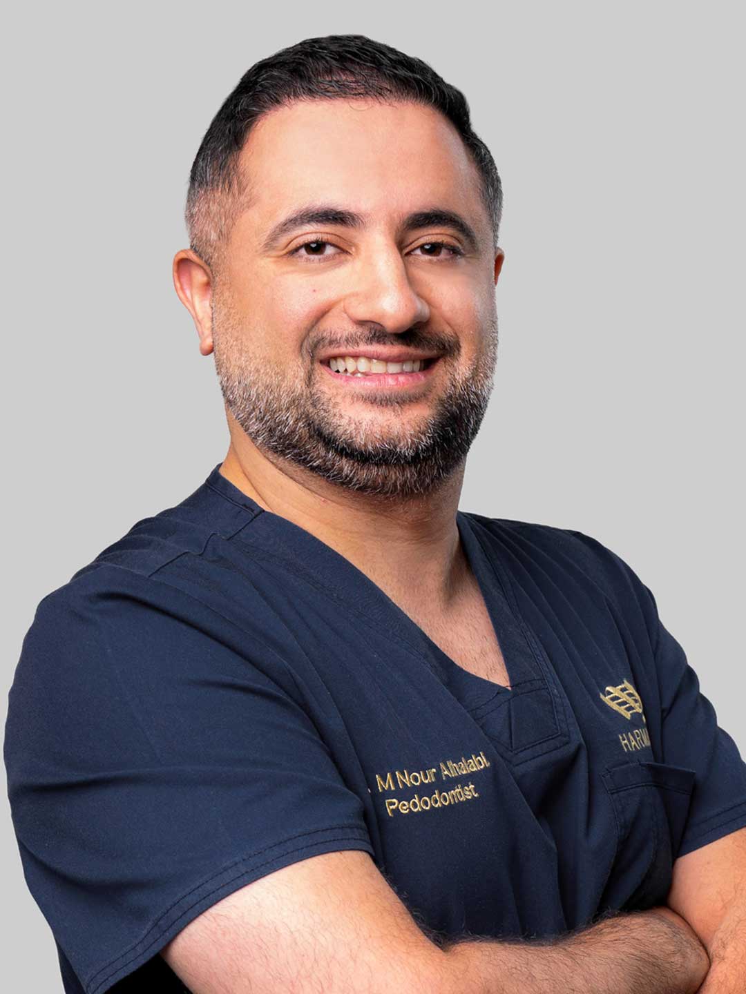 Portrait of Dr. M Nour AlHalabi - Head of Pediatric Dentistry at Harmony Medical Center in Dubai and Abu Dhabi