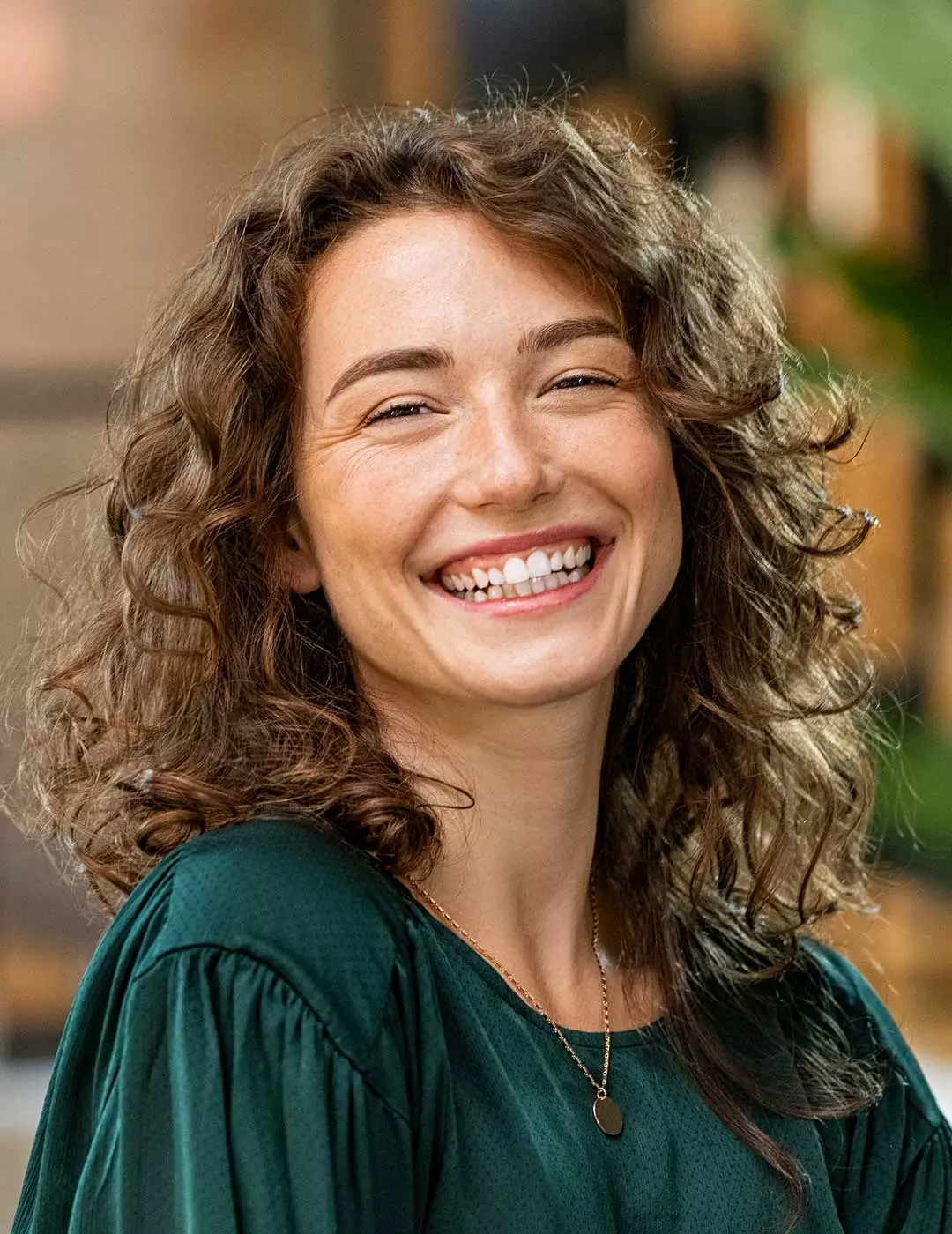 A photo of a woman smiling confidently