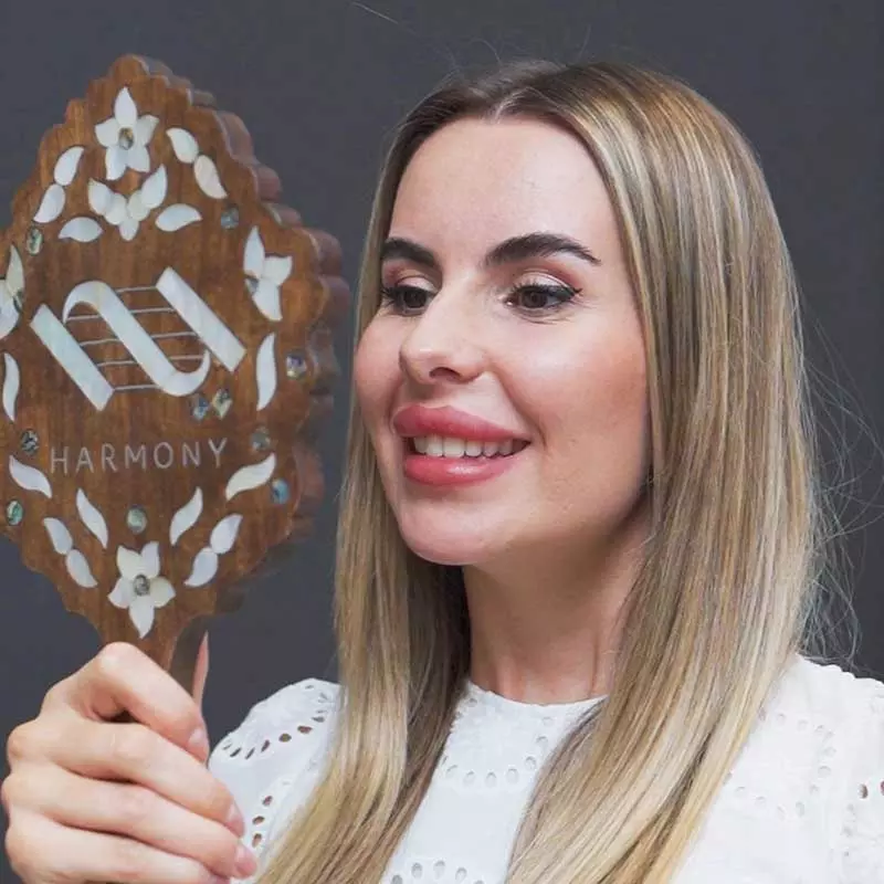 Maria Rosta, Dental Hygienist at Harmony Medical Center Dubai, performing a teeth whitening treatment for a patient.