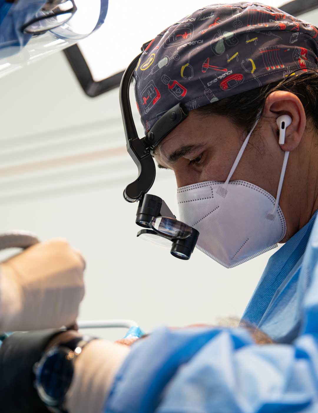 A photo of Dr. Ahmad Al Jazairi, Harmony Medical Center's Head Oral & Maxillofacial Surgeon with a patient.